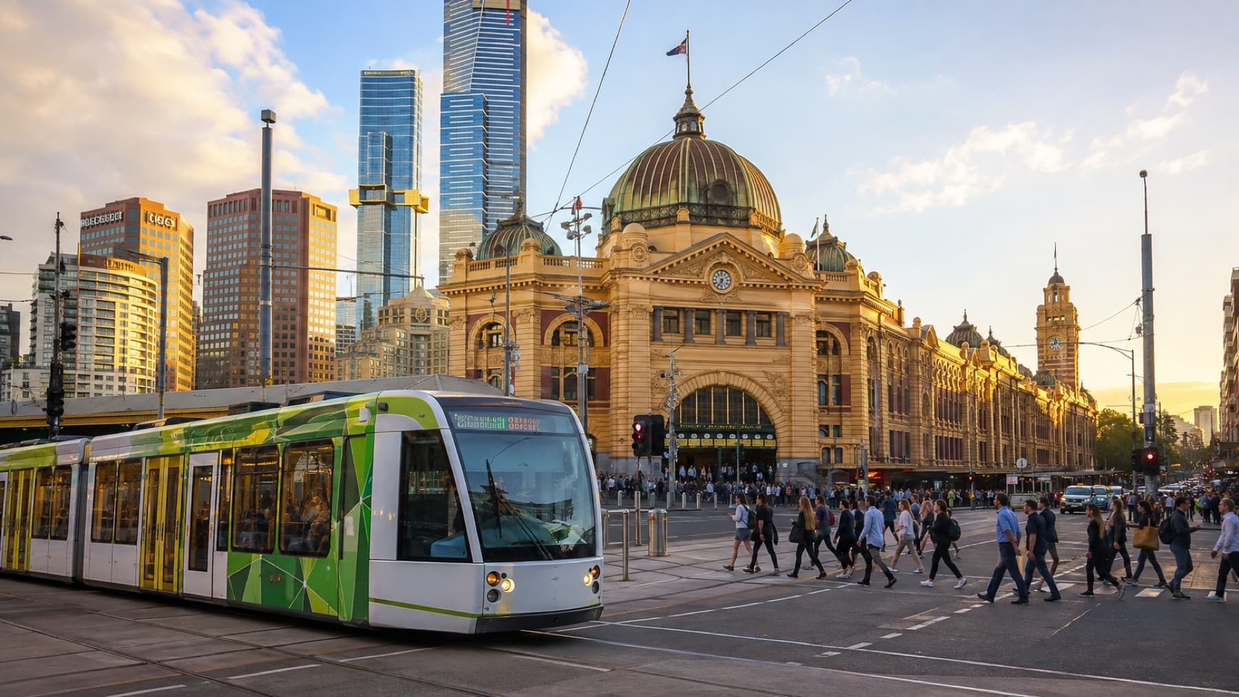 A tram at a historic station in golden light